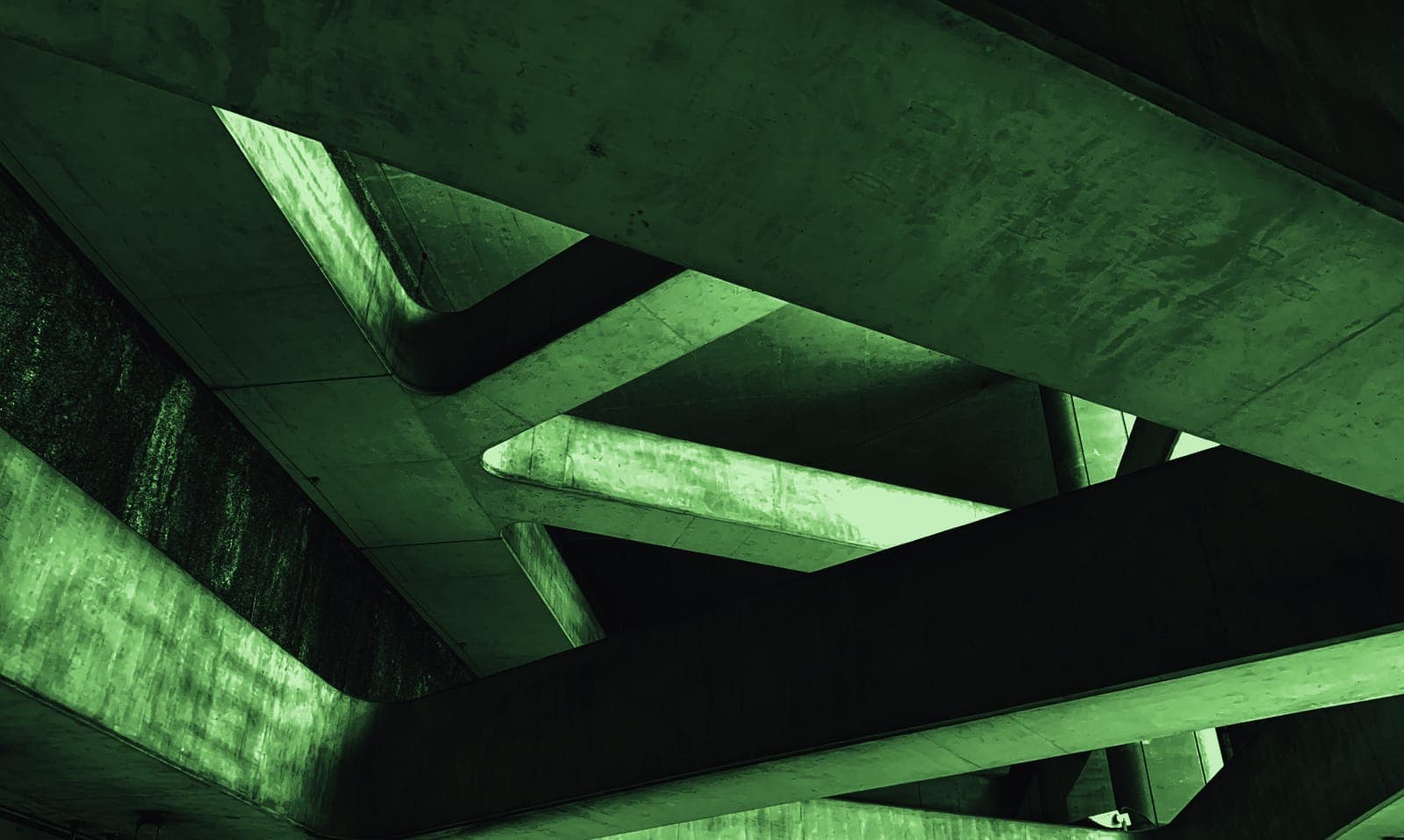 A concrete structure photographed against a flat sky