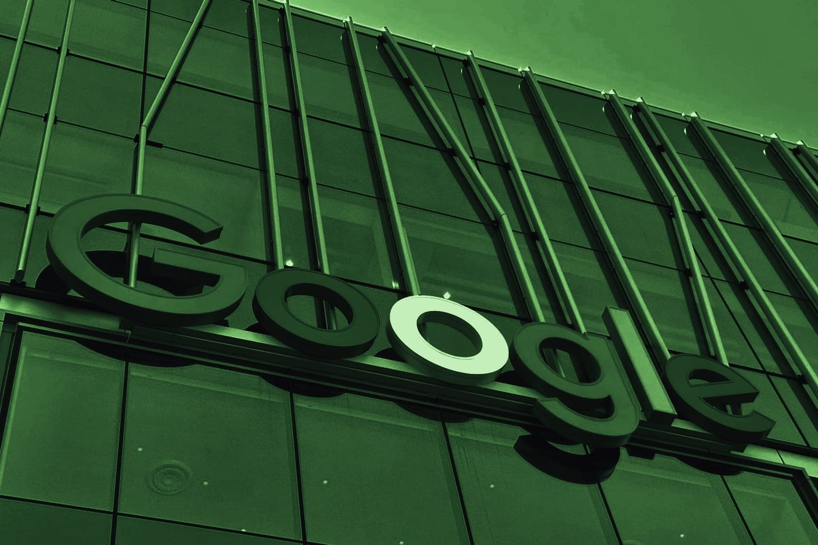 The Google logo on the glass facade of an office building