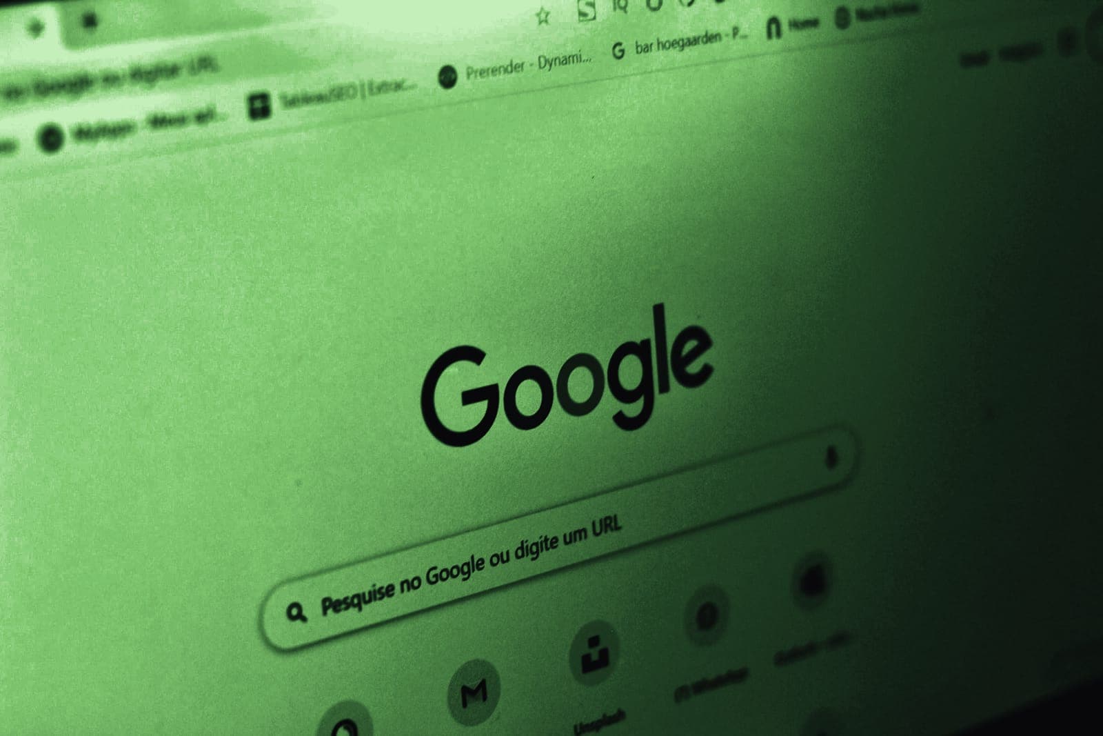 A Google search box open on a laptop screen